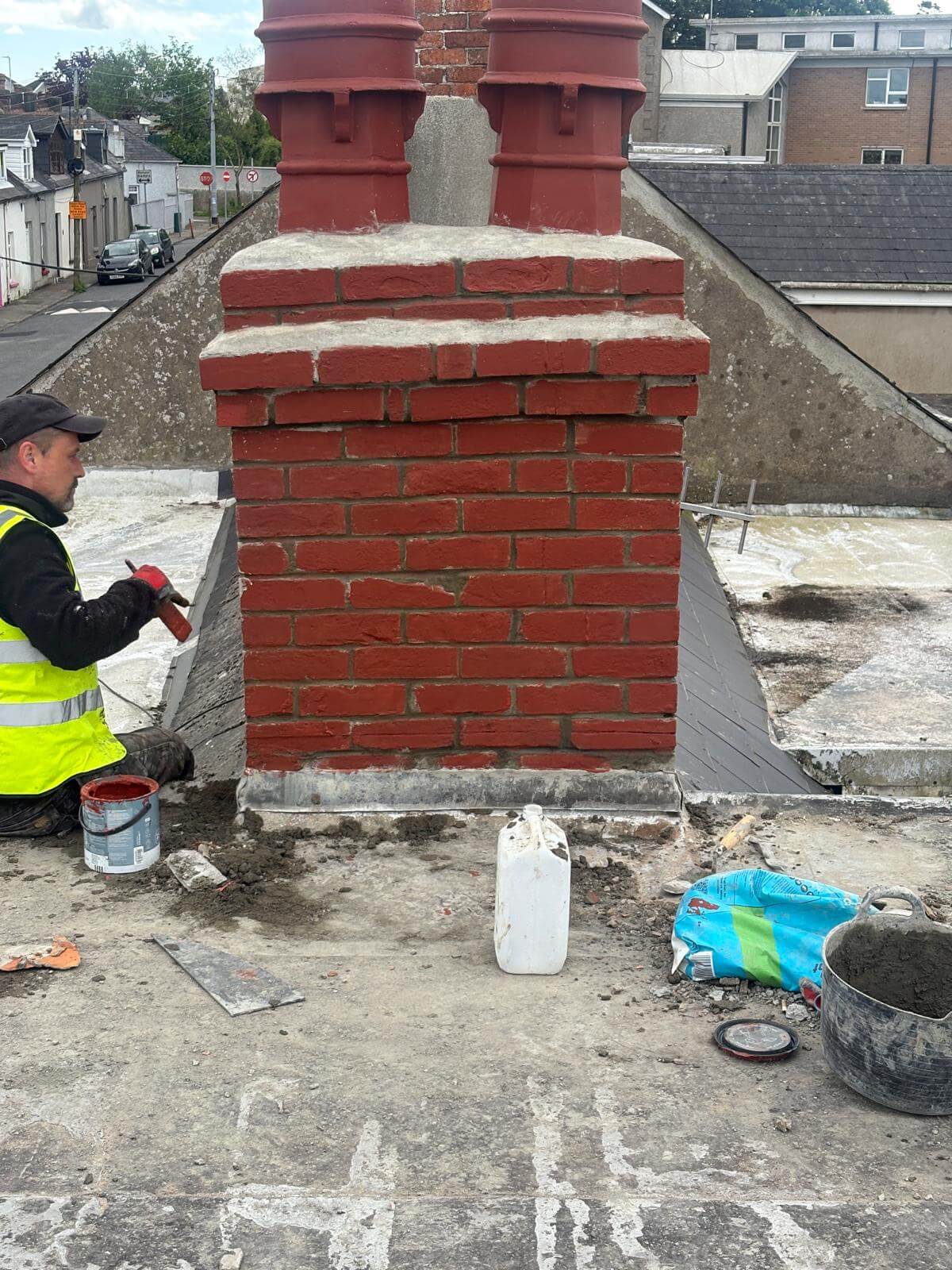 Roofers working on an old roof in Cork City